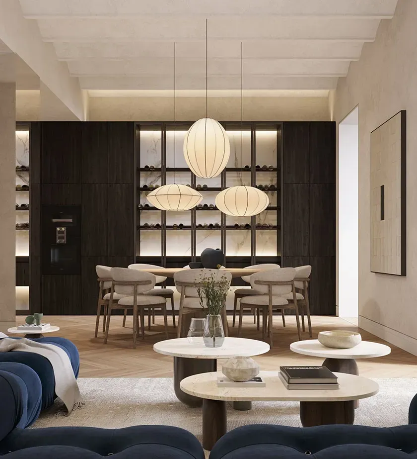 Sophisticated living and dining area with sculptural lighting, dark wood cabinetry, and modern luxury design details.