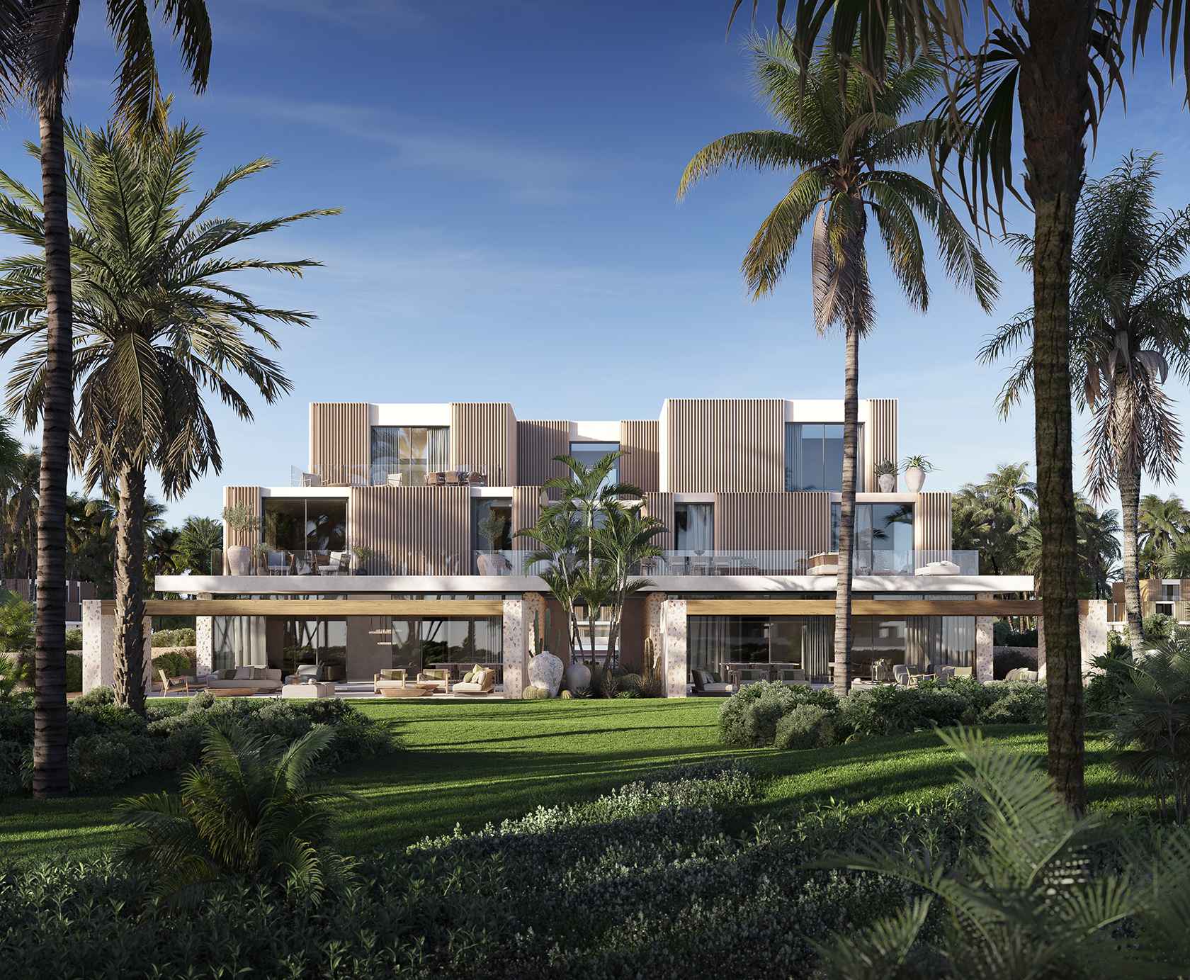 Chalets with private patios and open façades overlooking the Mediterranean.