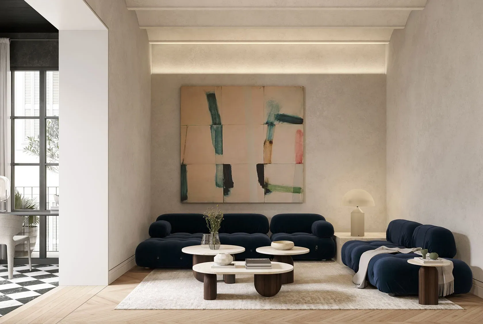 Contemporary living room with navy velvet sofas, abstract artwork, and soft natural lighting in a refined setting.