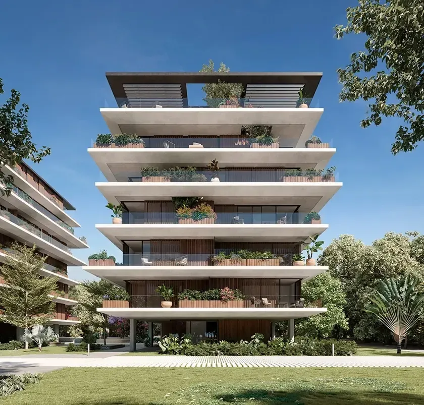 Detailed front view of LUV Studio’s luxury apartment building with layered terraces, wood accents, and abundant greenery under a clear blue sky.