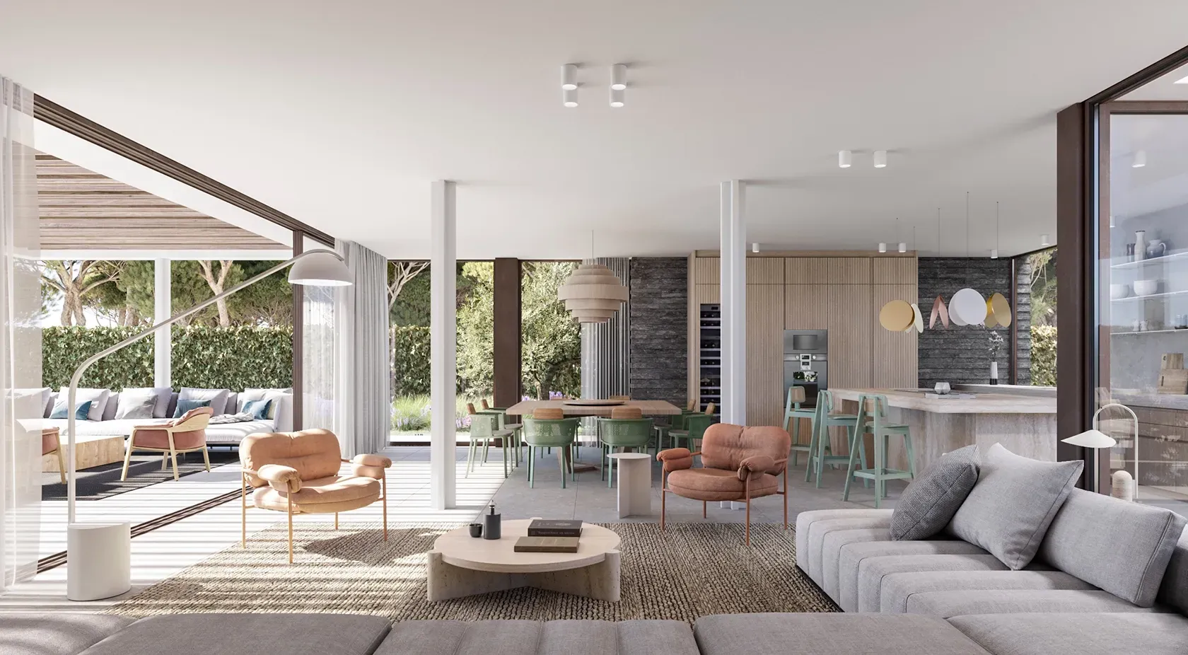 Open-plan interior with kitchen, dining, and living space flooded with natural light.