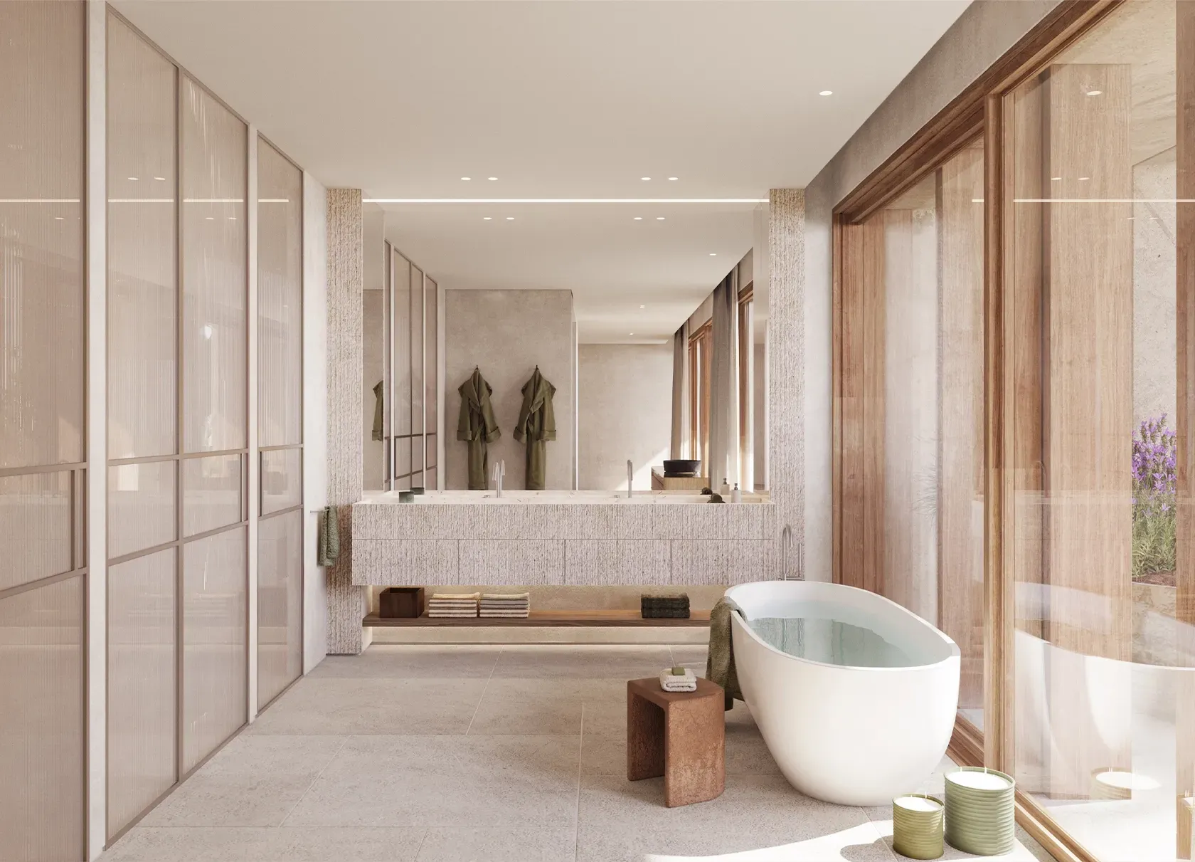 Modern master bathroom with freestanding bathtub, natural stone finishes, and warm light creating a spa-like luxury.
