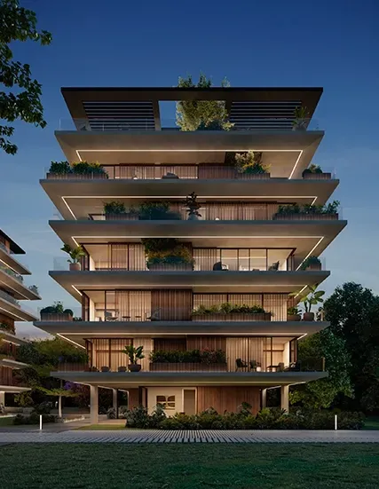 Night view of a luxury residential building by LUV Studio, with warm lighting, modern terraces, and rich landscaping, blending elegance with serenity.