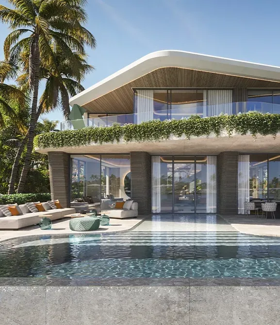 Modern villa with lush greenery, curved roof, and luxury poolside lounge area.