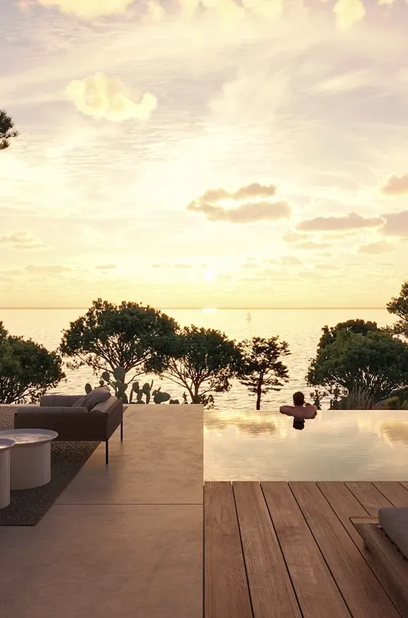 Tranquil sunset view from the infinity pool overlooking the sea, highlighting the serene lifestyle of this LUV Studio residence.