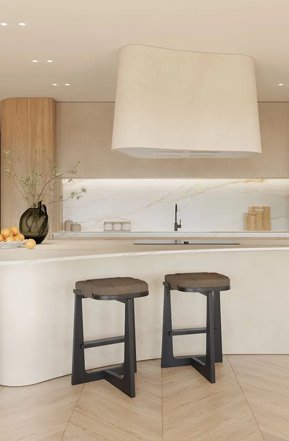 Sculptural kitchen with a central stone and marble island, blending light and elegant design.