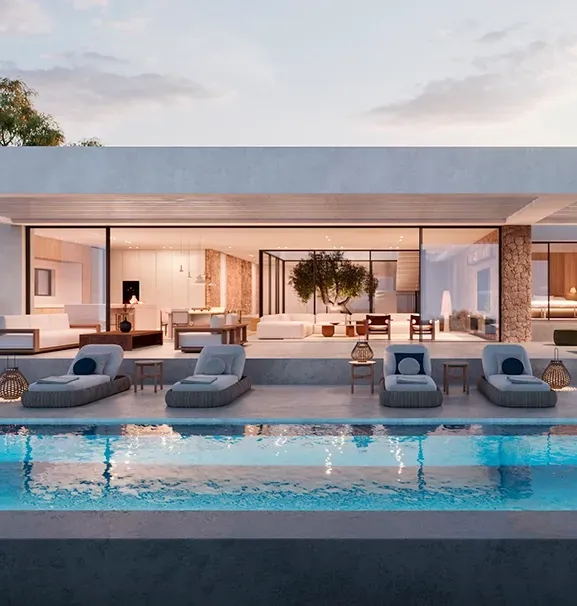 Night view of the villa exterior with illuminated interiors, pool reflections, and seamless transition between indoor and outdoor spaces.