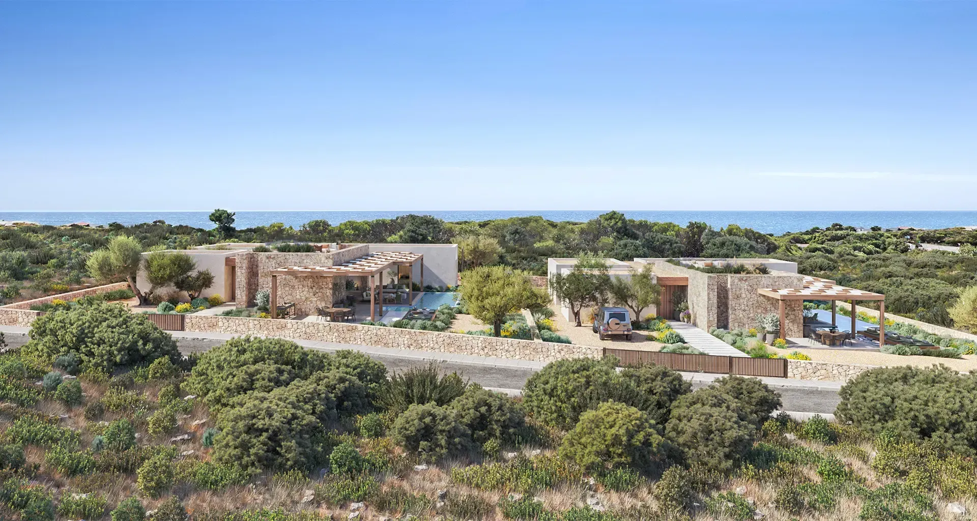Aerial view of a luxury seaside villa with minimalist architecture, surrounded by Mediterranean landscape.