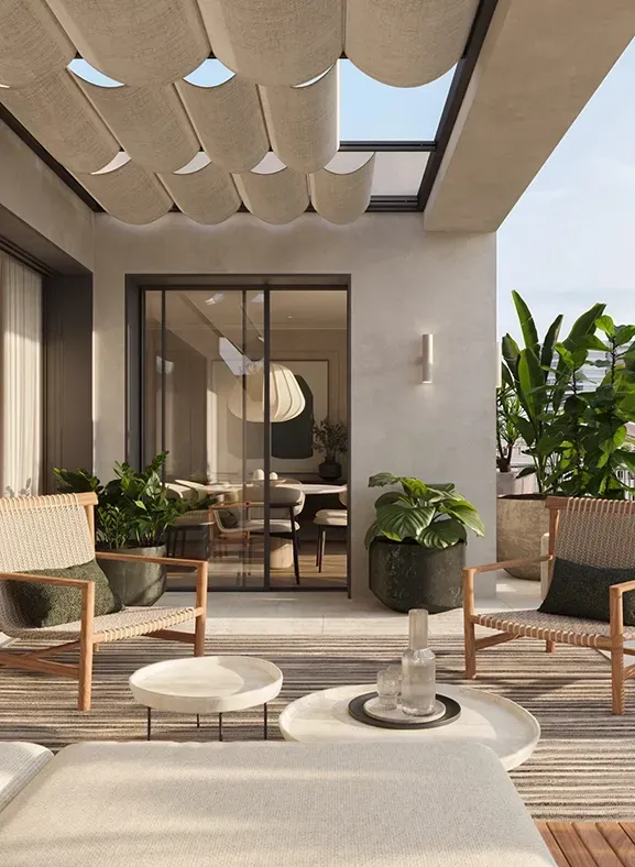 Sunlit terrace by LUV Studio with woven lounge chairs, sculptural plants and retractable fabric pergola overlooking the city skyline.