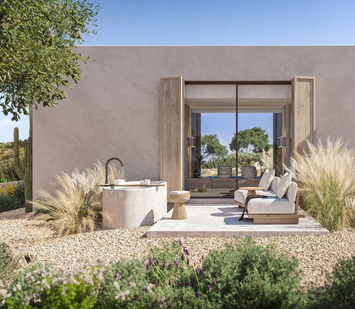 Outdoor bathtub with sea views and privacy walls, integrating luxury wellness into coastal architecture.