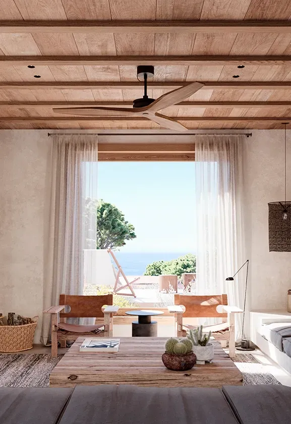 Cozy living room with custom sofa, natural textures, and sea view, in a LUV Studio Formentera home.