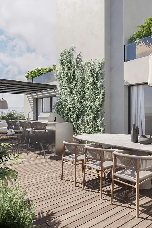 Spacious terrace with outdoor dining, barbecue area, and lush greenery in a luxury residential setting.