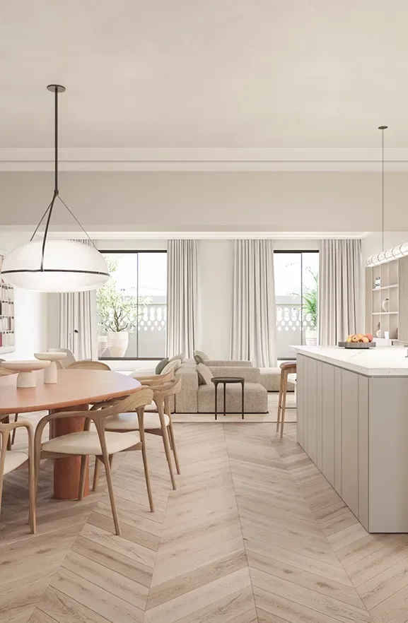 Elegant kitchen and dining area with large island, designer lighting, and premium wood textures.