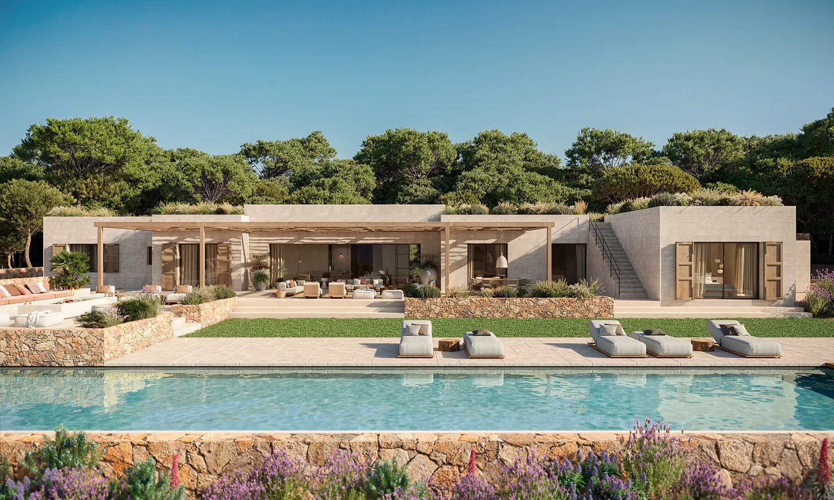 Modern Mediterranean villa with lush landscaping, stone walls, and an inviting poolside lounge.
