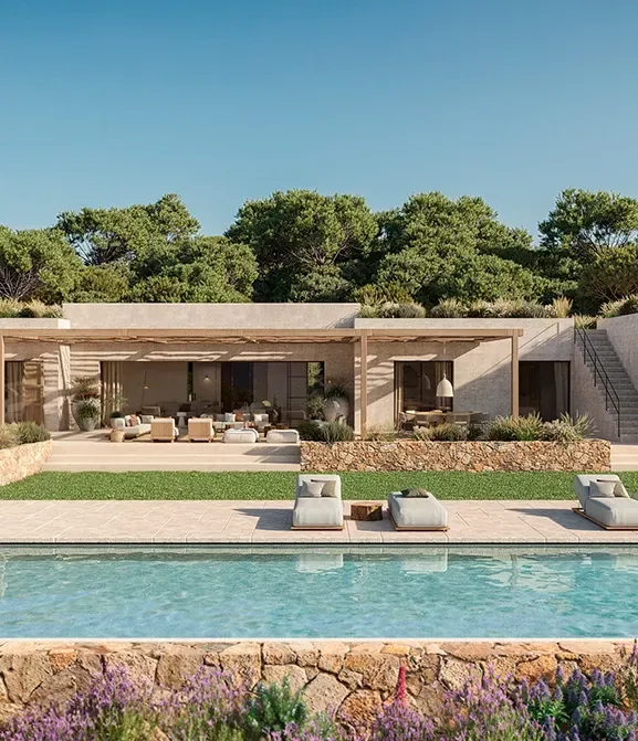 Modern Mediterranean villa with lush landscaping, stone walls, and an inviting poolside lounge.