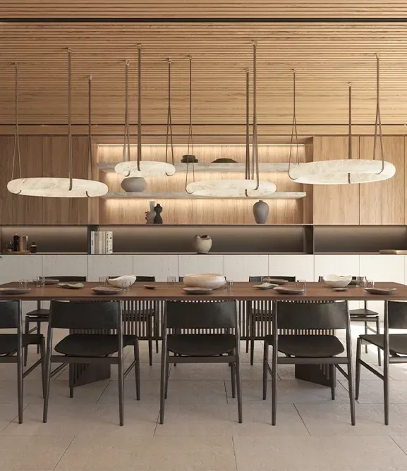 Modern dining area with wooden accents, sculptural lighting, and a minimalist aesthetic exuding warmth and sophistication.