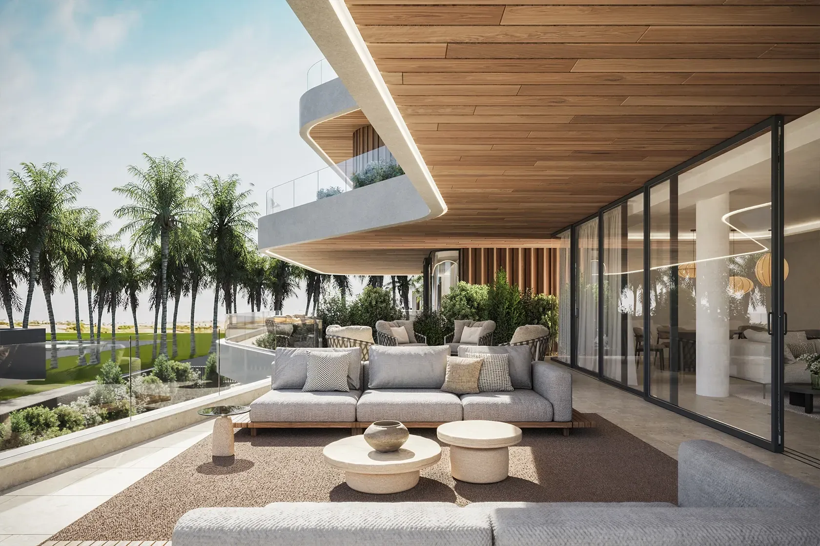 Outdoor lounge on a covered terrace with views of lush palms and a sculptural ceiling.