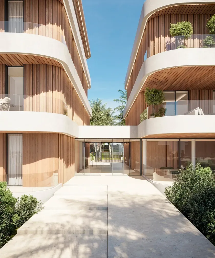 Elegant access corridor between two wood-clad apartment buildings designed by LUV Studio under clear blue skies.