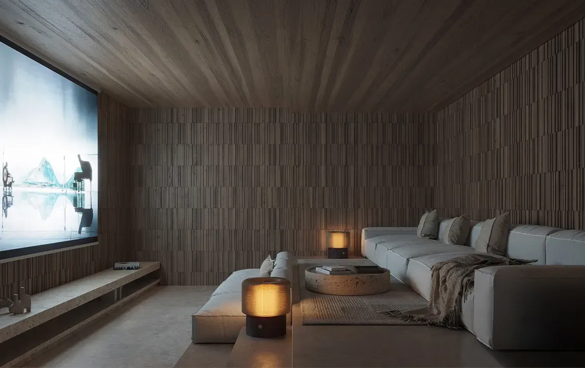 Dark luxury home cinema with ambient lighting, large screen, and sleek finishes, creating a cozy entertainment space in Punta Cana residence.
