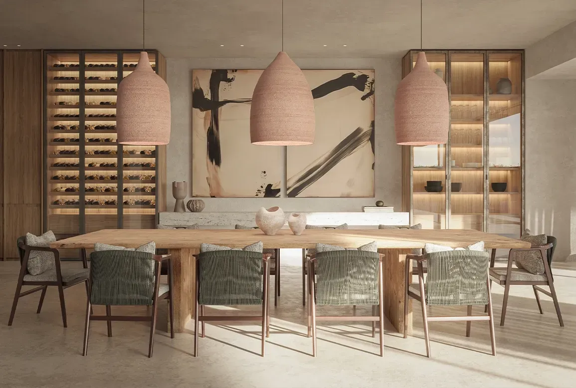 Modern dining room with sculptural lighting, natural wood elements, and elegant table setting, designed for luxury living in Punta Cana.