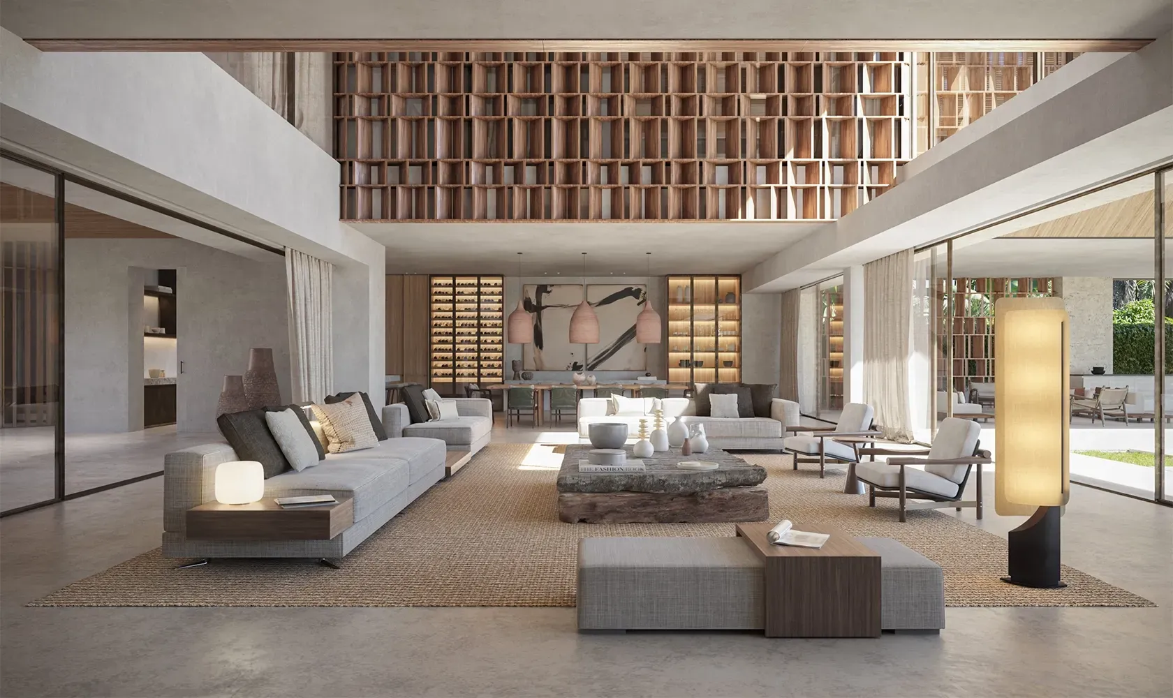 Contemporary living room with large windows, custom shelving, and natural tones, showcasing luxury design in a Punta Cana beachfront home.