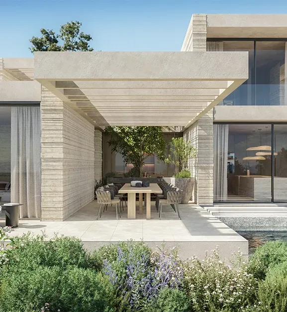Modern luxury pergola and dining space seamlessly integrated with the villa’s architectural design and natural surroundings.