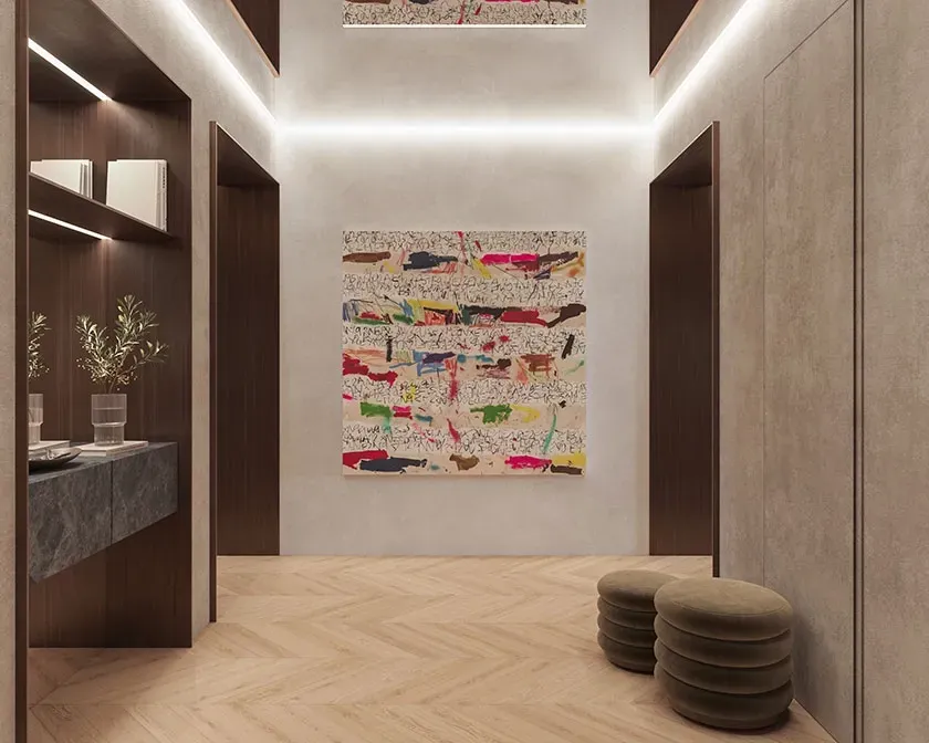 Elegant hallway with herringbone flooring, recessed lighting, and colorful abstract art, exuding architectural luxury.
