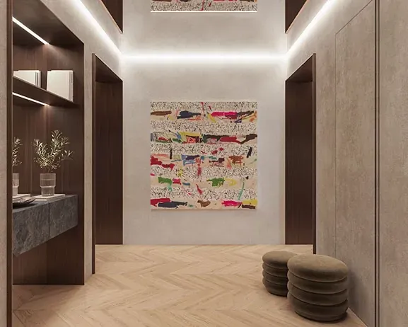 Elegant hallway with herringbone flooring, recessed lighting, and colorful abstract art, exuding architectural luxury.