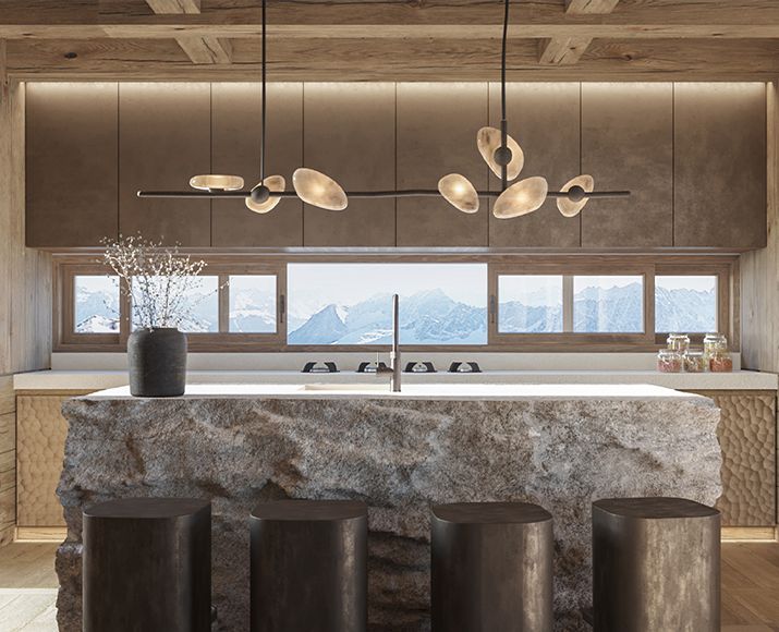 Luxury kitchen with a stone island, panoramic mountain views, and architectural lighting suspended from a wood ceiling.