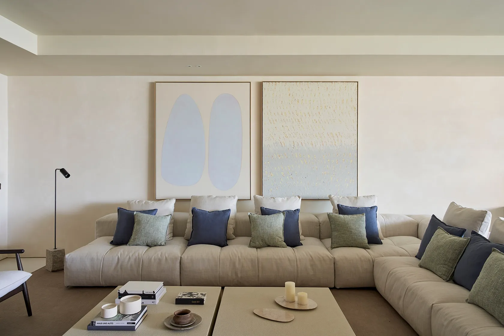 Open-plan lounge with timeless Mediterranean ambiance, contemporary art, and natural fabrics in Es Pouet Ibiza residence