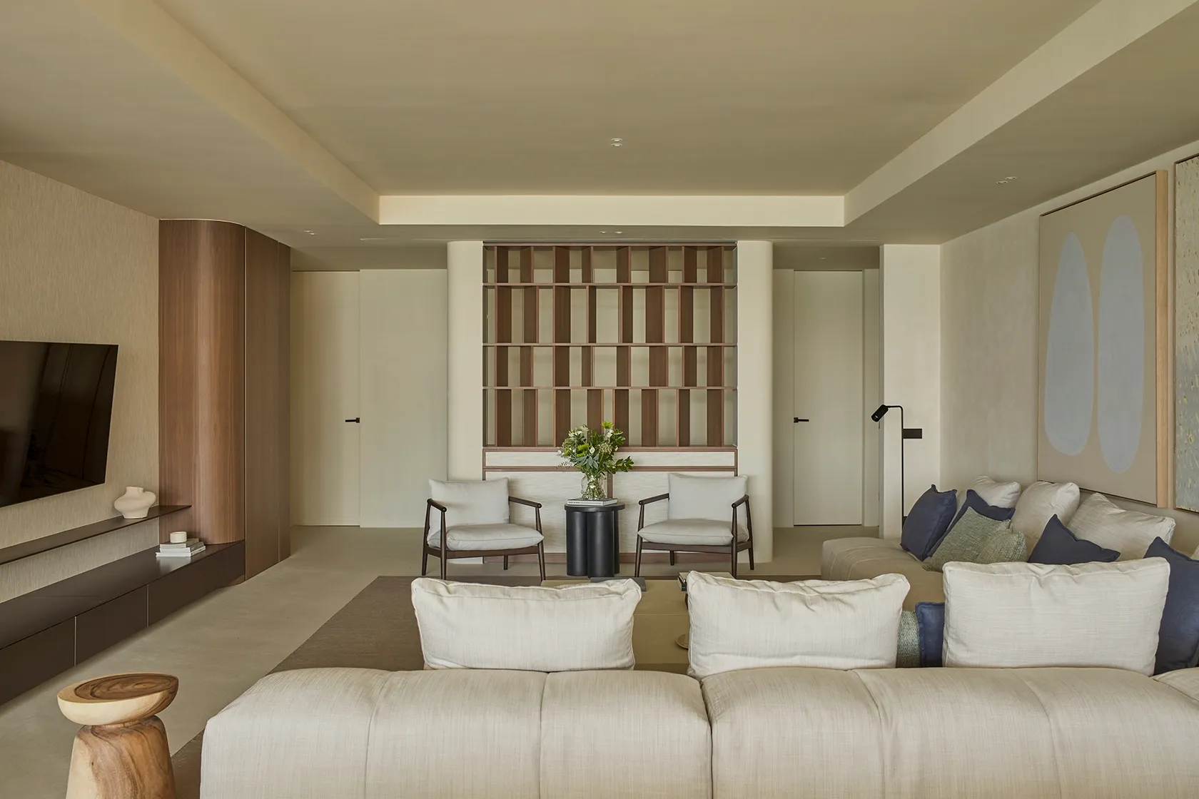 Contemporary living room with modular sofa, custom shelving, and Mediterranean calm atmosphere