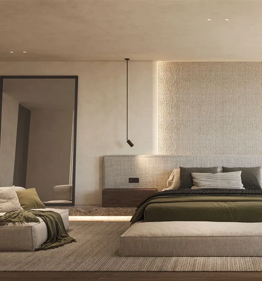 Serene master suite with textured walls, earth-toned bedding, hanging lights, and a private workspace, designed for calm and elevated living.