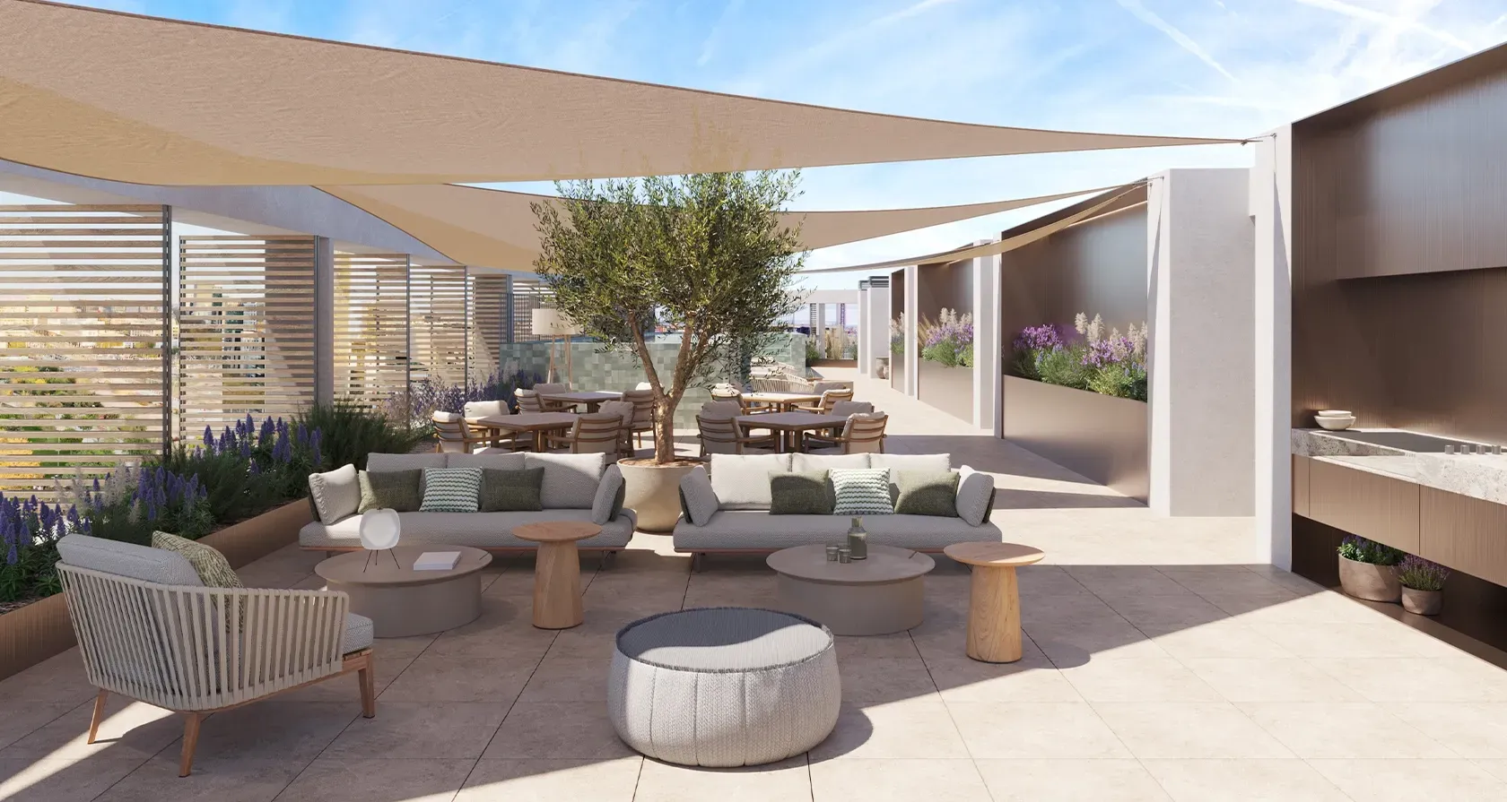Elegant rooftop terrace with shaded lounge area, cozy seating, greenery, and modern outdoor kitchen for luxury al fresco living and relaxation.
