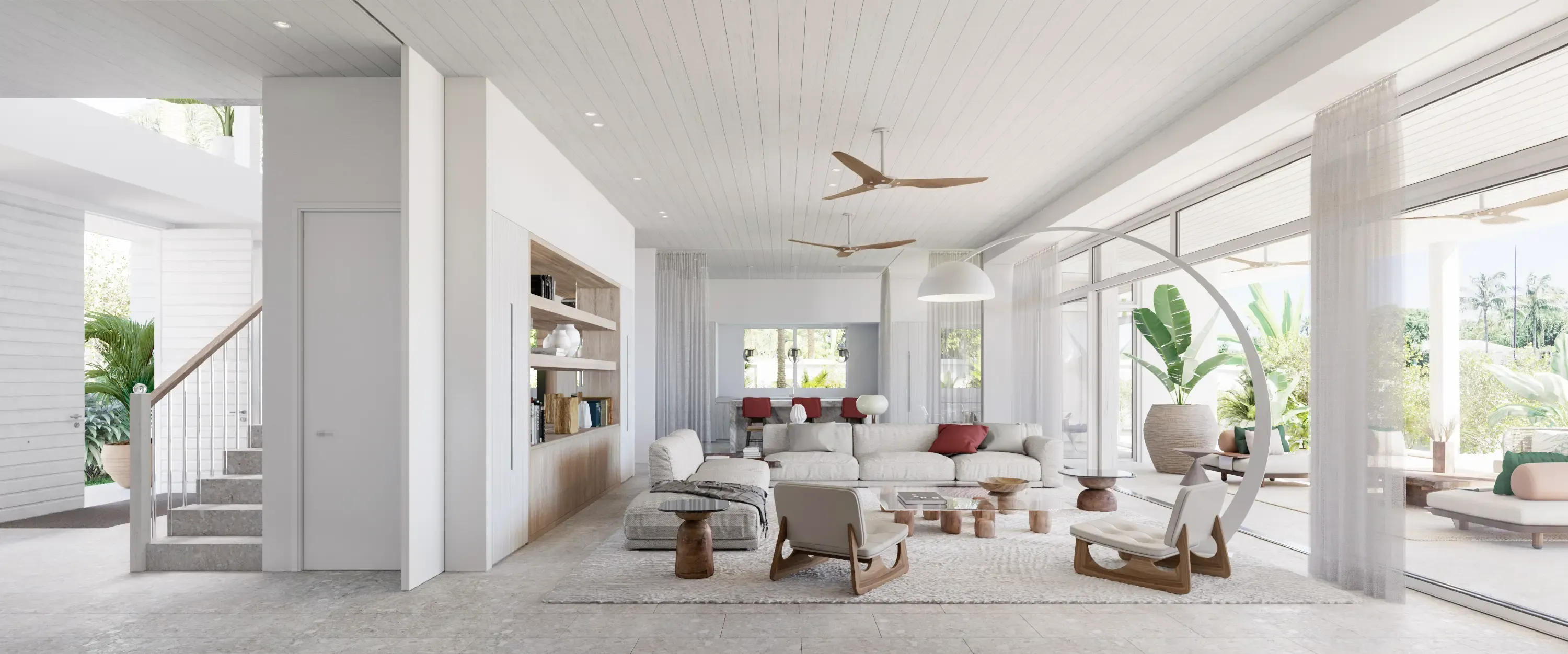 Elegant living area with modern furniture, soft tones, and access to outdoor lounge by the water.