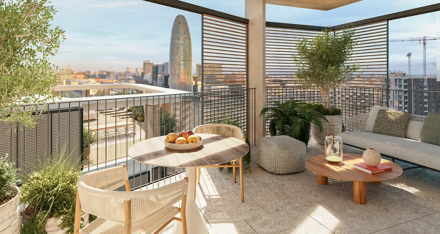 Beautifully designed terrace with lush greenery, elegant seating and open views of Barcelona, framed by modern wooden privacy panels.