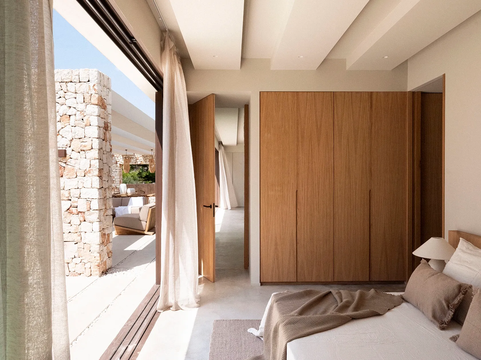 Bedrooms designed for calm, privacy, and connection to Menorca.