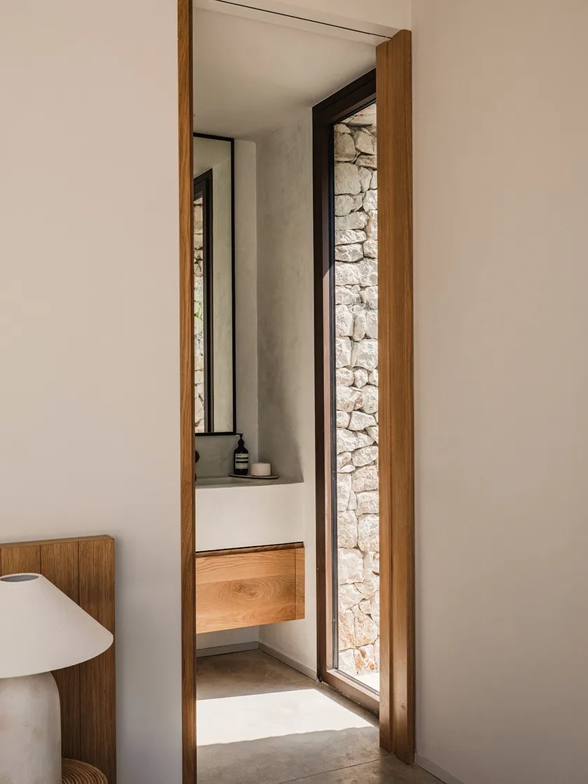 Bathrooms where stone and lime create warmth and calm.