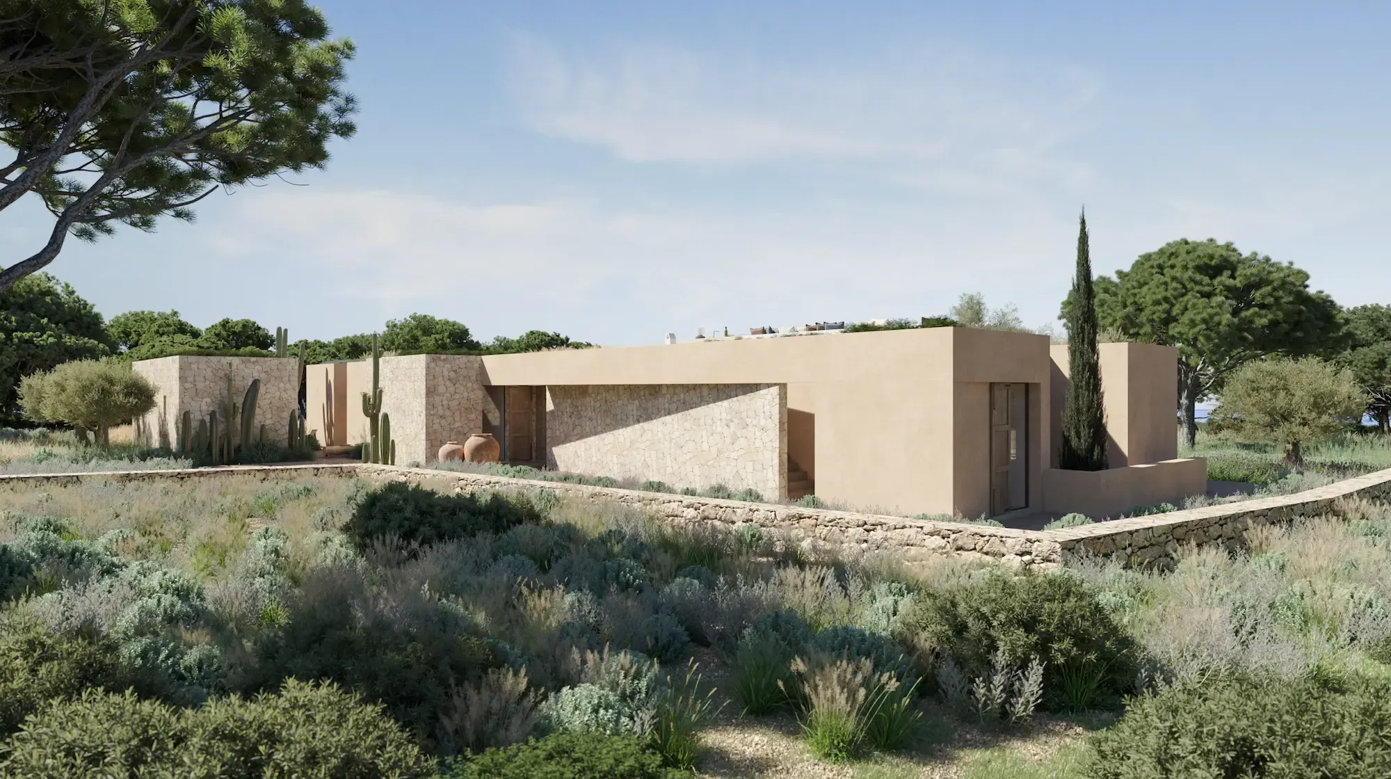 Aerial view of the villa blending into the Mediterranean landscape with natural stone and earth-toned architecture.