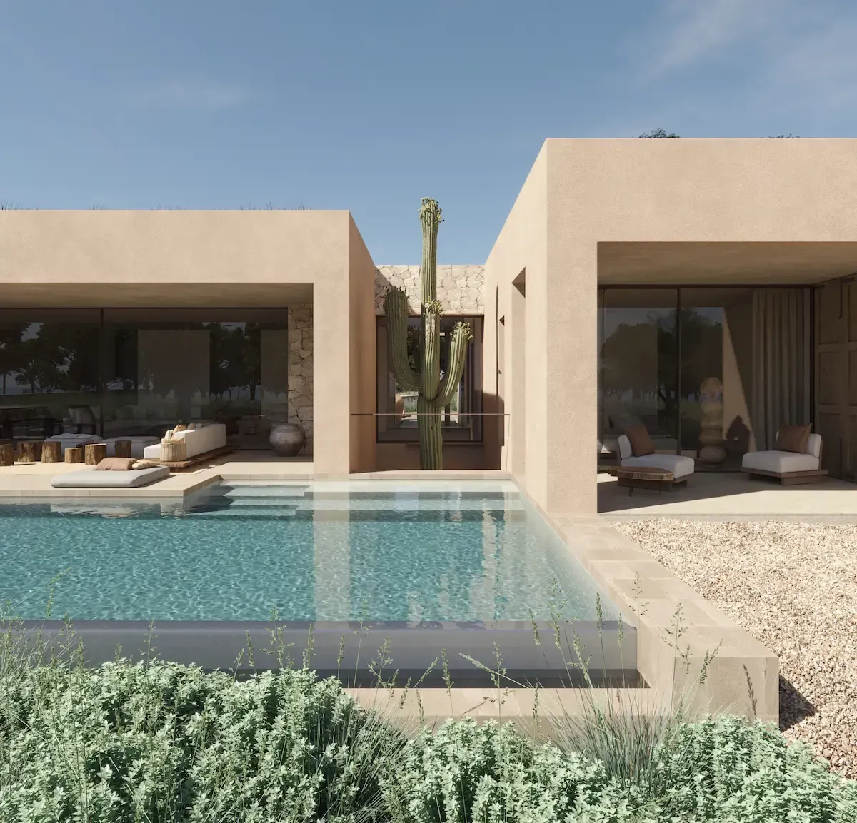 Infinity pool and cactus courtyard between two volumes of the contemporary Formentera villa by Luv studio.
