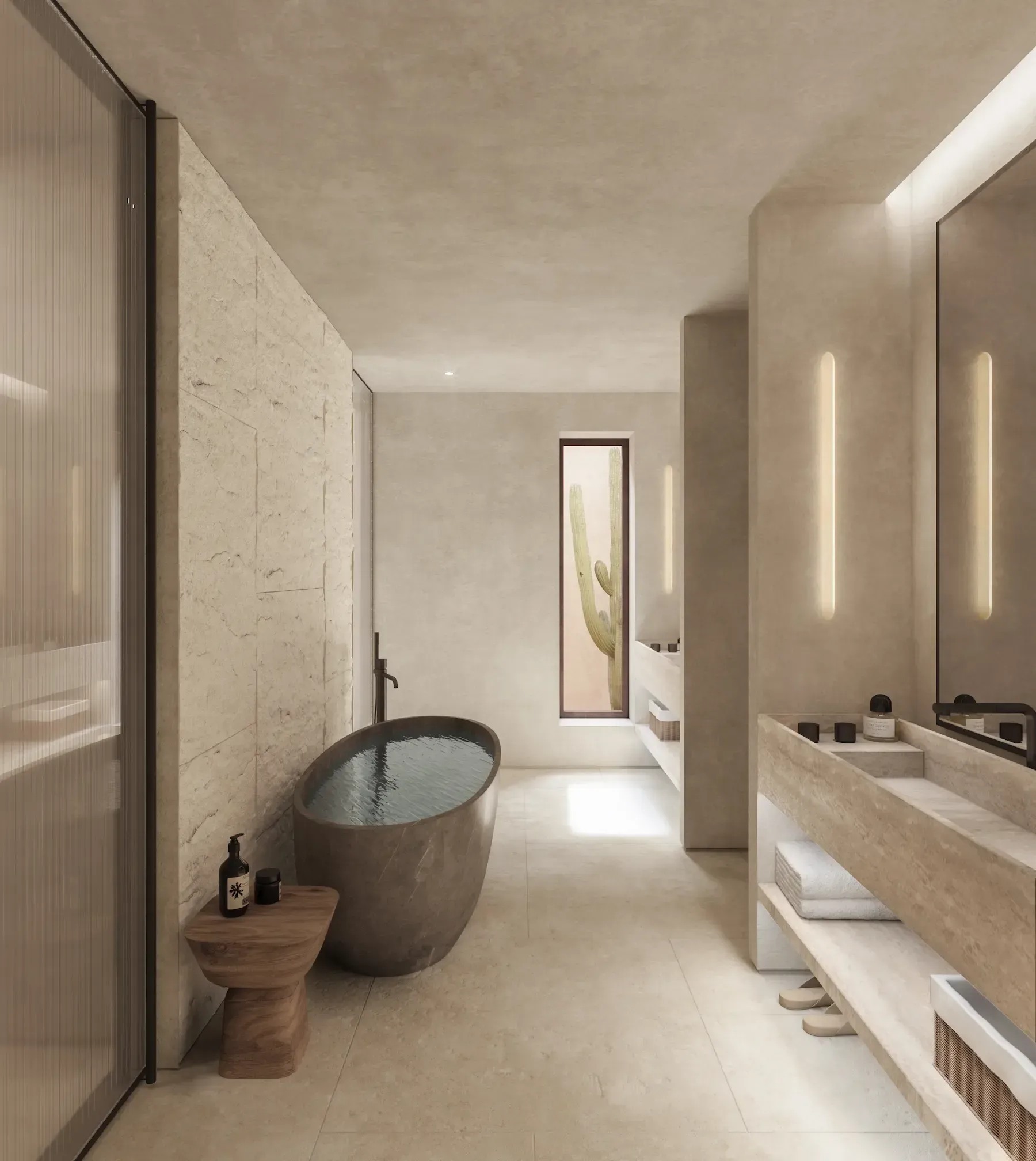 Minimalist luxury bathroom interior featuring natural stone, sculptural bathtub, and cactus view window.
