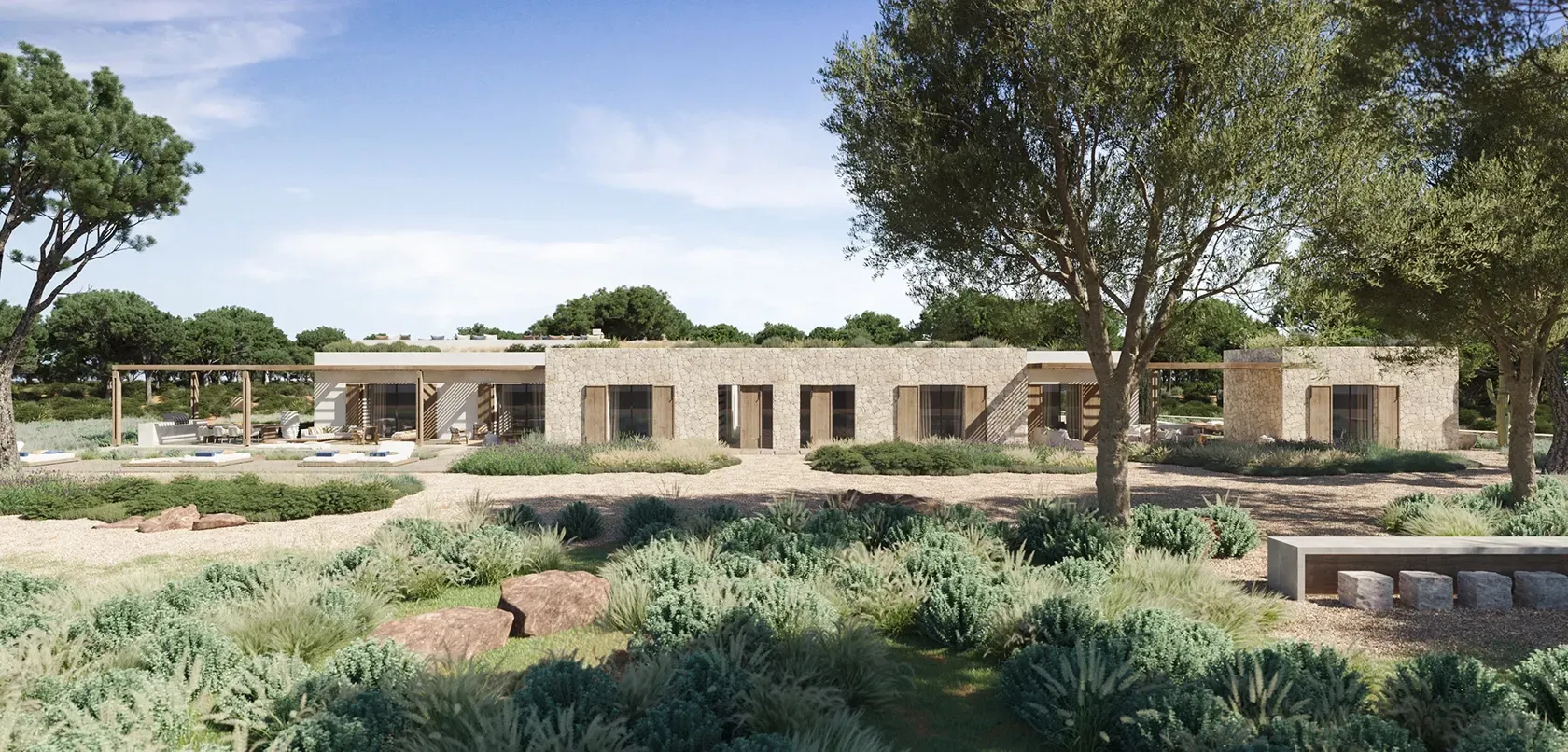 Elegant coastal villa with sun loungers and shaded terraces integrated into the natural landscape.
