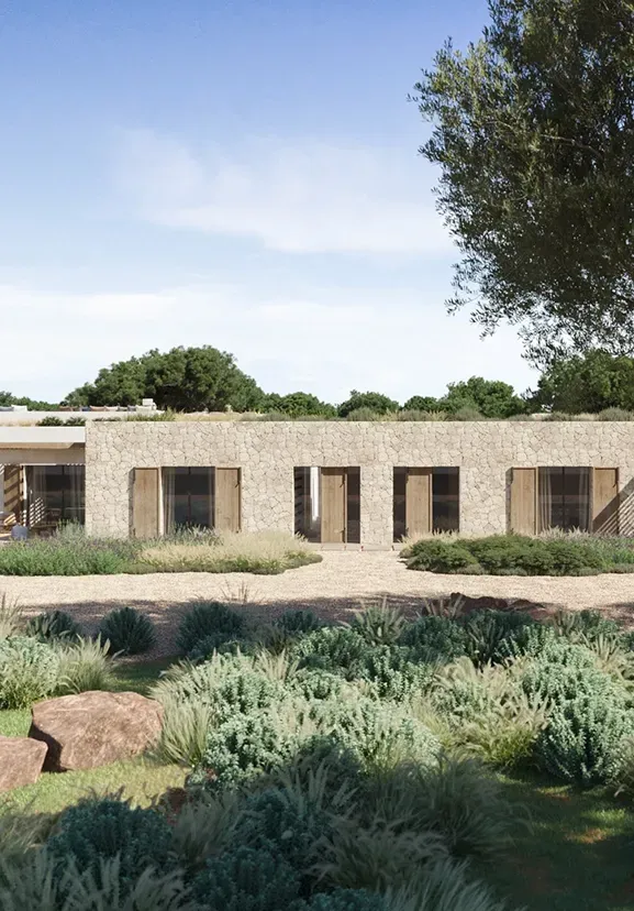 Elegant coastal villa with sun loungers and shaded terraces integrated into the natural landscape.