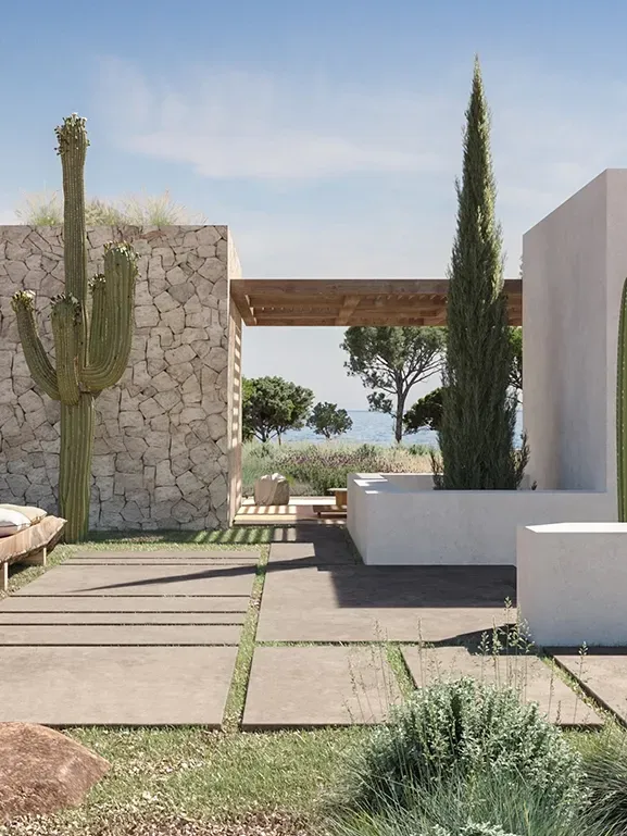 Cactus-lined walkway connecting villa volumes, showcasing refined desert-inspired architecture.