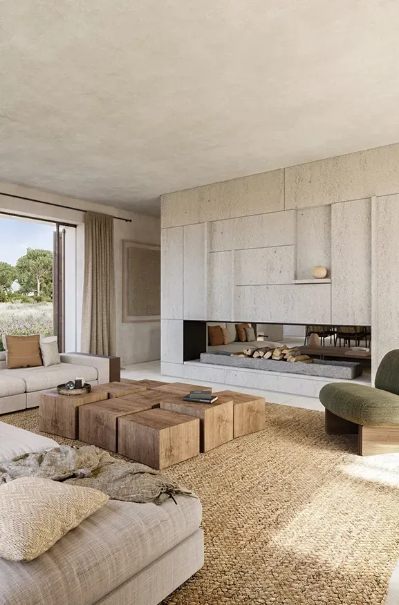 Cozy living area with layered textures, a modern fireplace, and scenic landscape views.