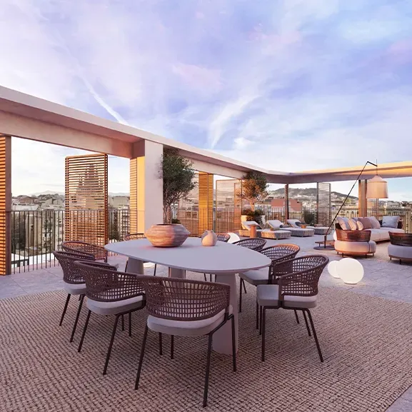 Elegant rooftop terrace with outdoor dining area, modern loungers, and sunset views framed by architectural pergolas and warm lighting.