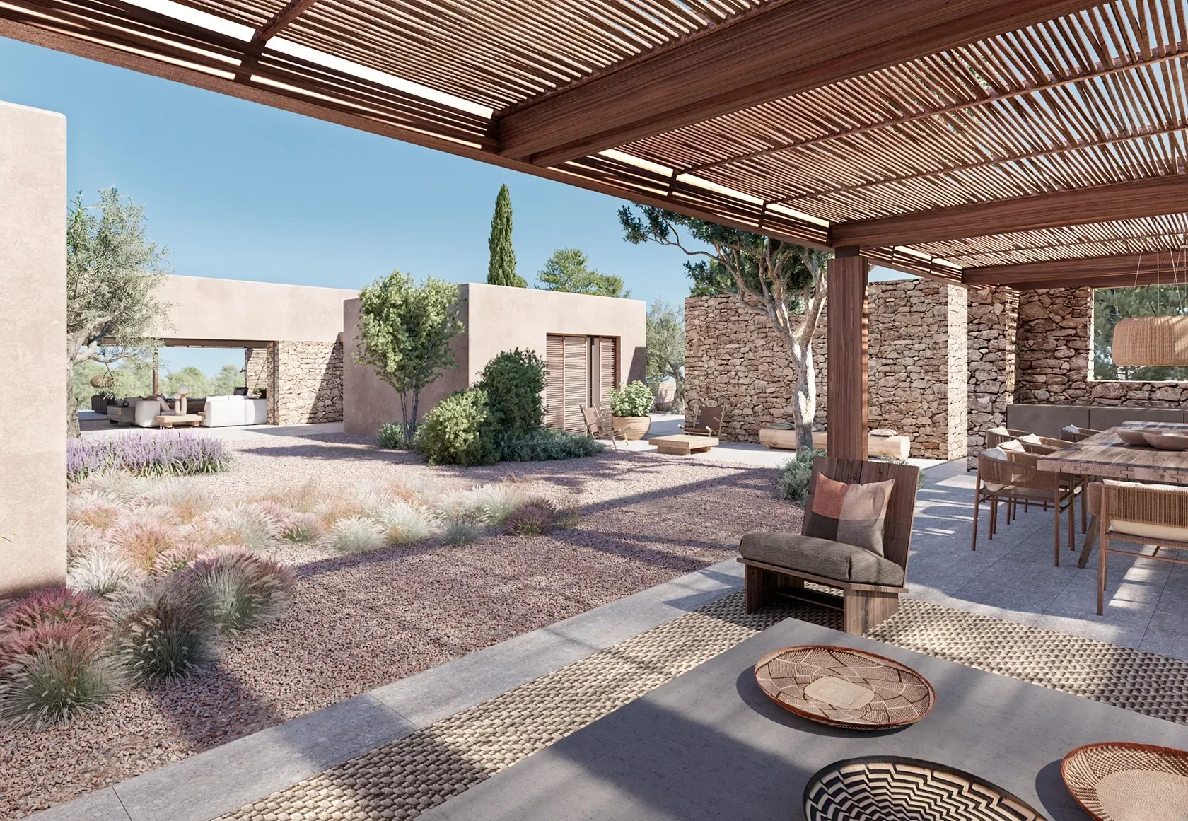 Tranquil courtyard with olive tree and wood furniture blending architecture and nature in LUV Studio Ibiza home.