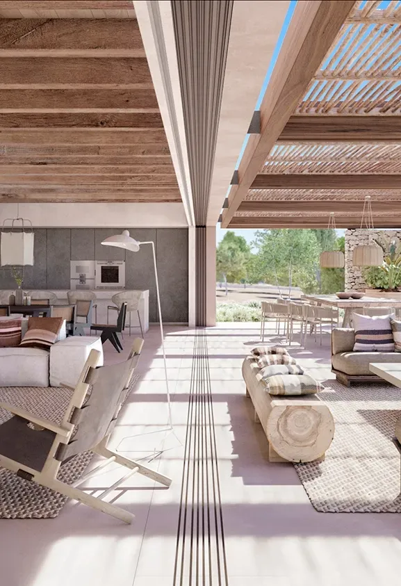 Open-plan living and dining space under wood beam ceiling with natural textures and sea view in Ibiza.
