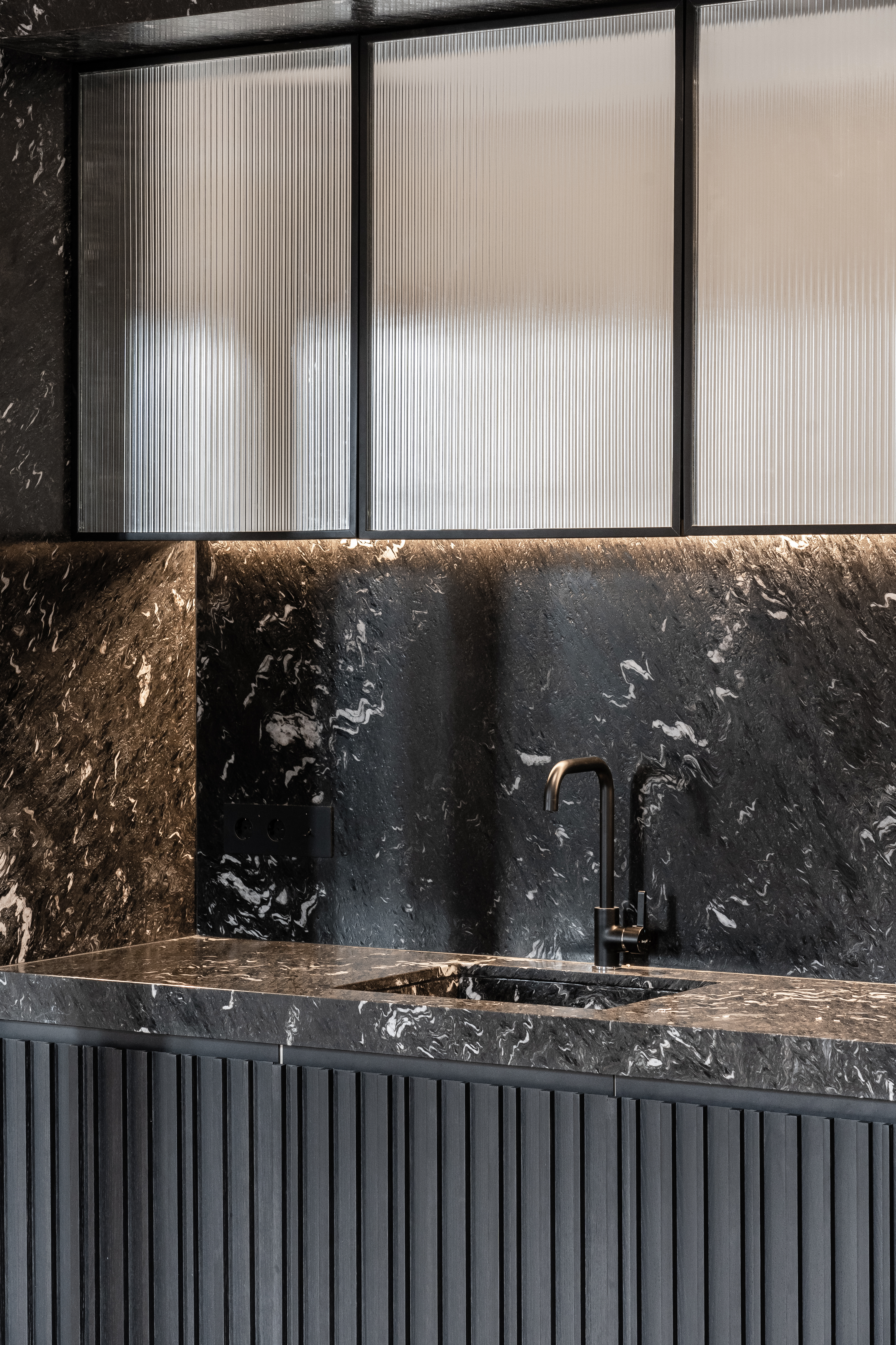 Detail of the modern kitchen finishes and textures.