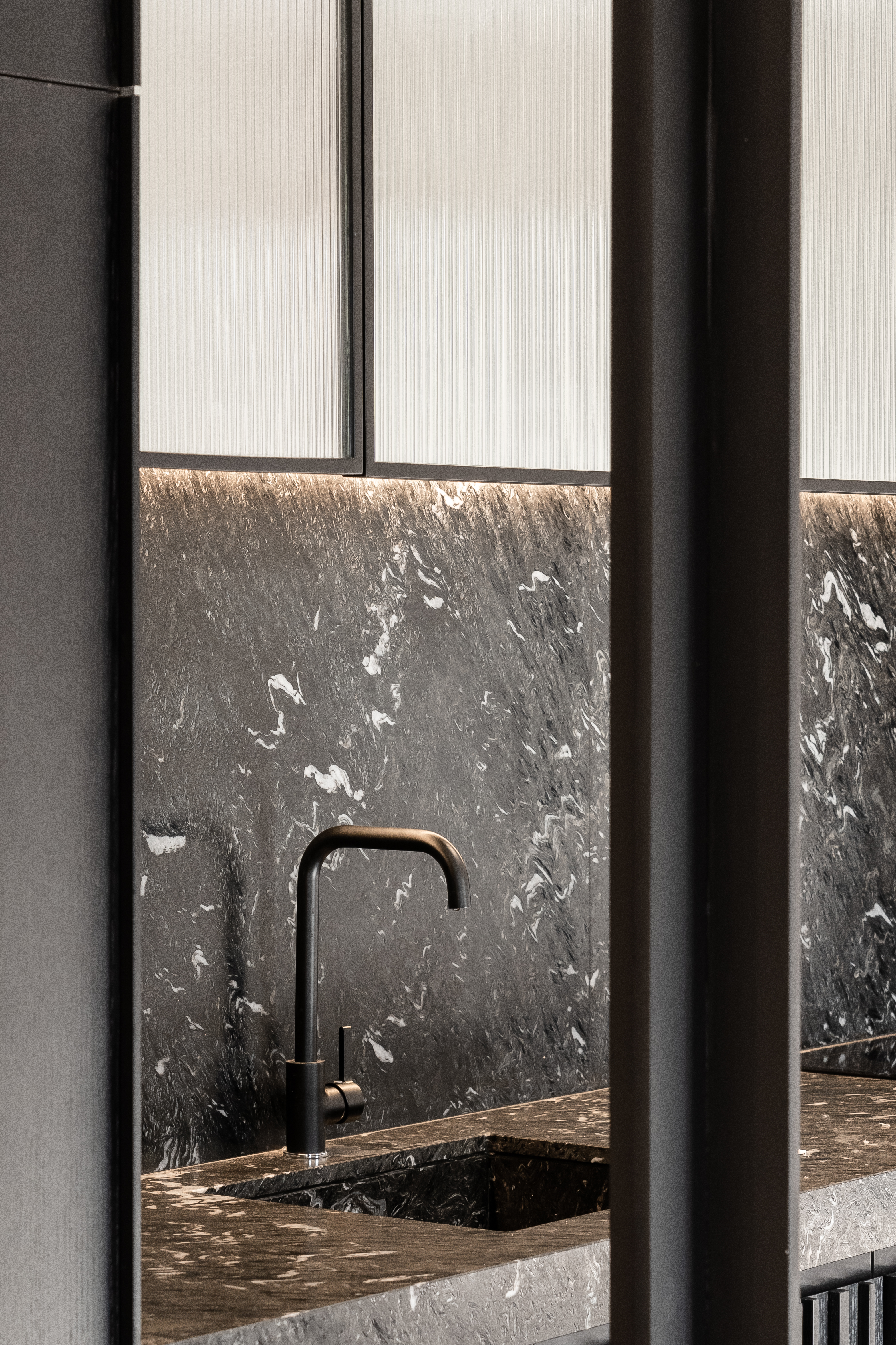 Detail of the modern kitchen finishes and textures.