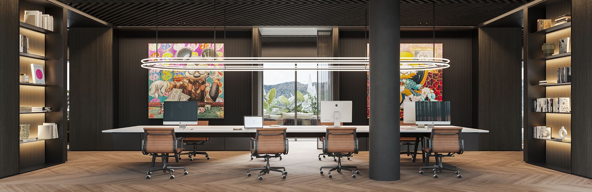 Contemporary open-plan office with shared desks, modern lighting, pop art on dark walls, and built-in bookshelves at LUV Studio Andorra.